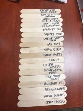 craft stick with prize examples printed on them